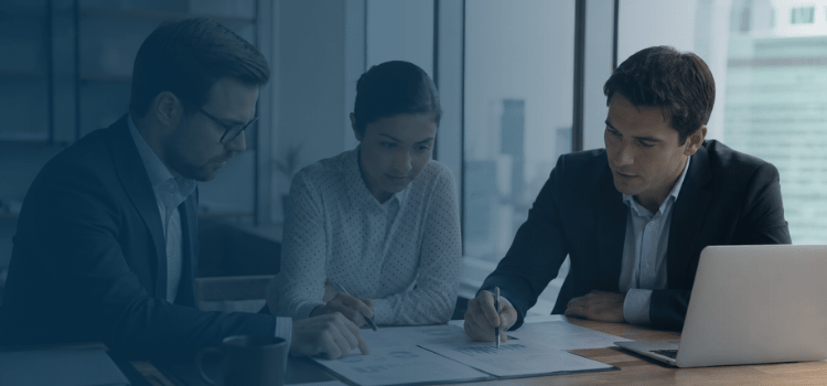 Professional advisors reviewing Texas franchise tax compliance documents in an office