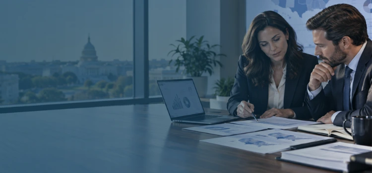 Business professionals reviewing U.S. corporate tax rate data, financial reports, and state tax information in a modern office.